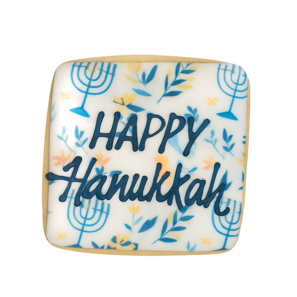 Square Hanukkah cookie with blue menorah and floral icing.