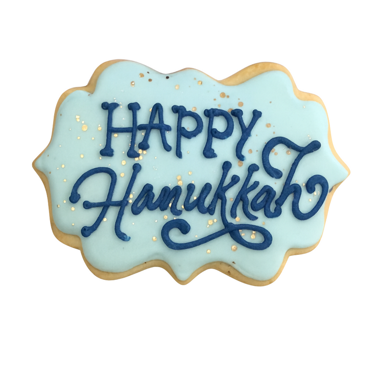 Hanukkah cookie with light blue icing and blue lettering.