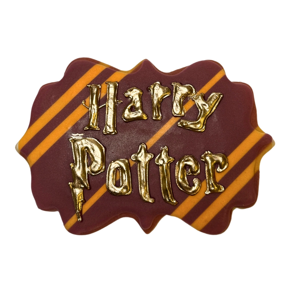 Harry Potter cookie with gold lettering on maroon and gold stripes