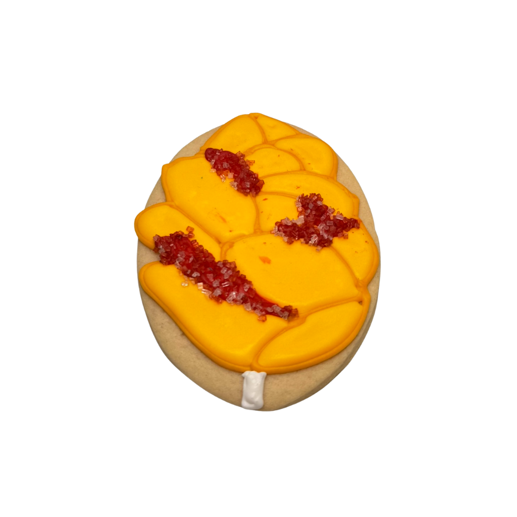 Hispanic Heritage cookie shaped like a yellow mango.