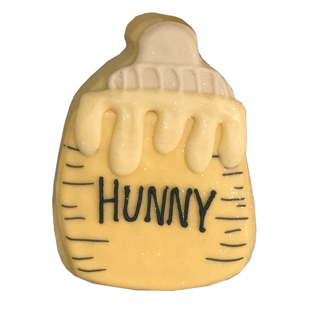 Hunny honey pot shaped cookie with yellow icing