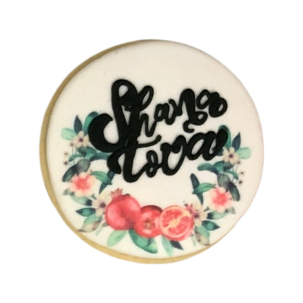 Jewish High Holidays cookie with Shana Tova and pomegranate art.