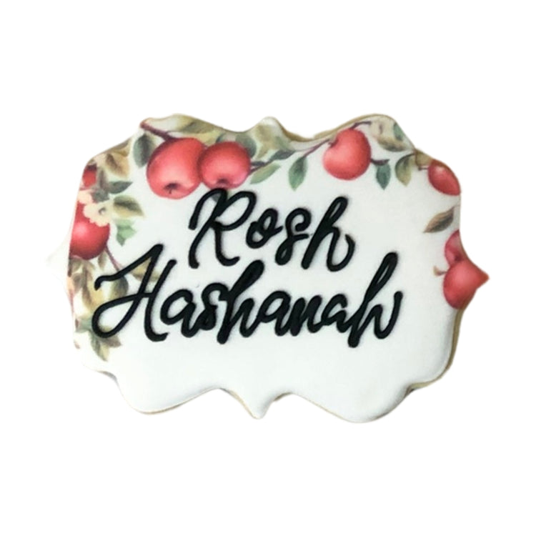 Rosh Hashanah cookie with black script and apple print border