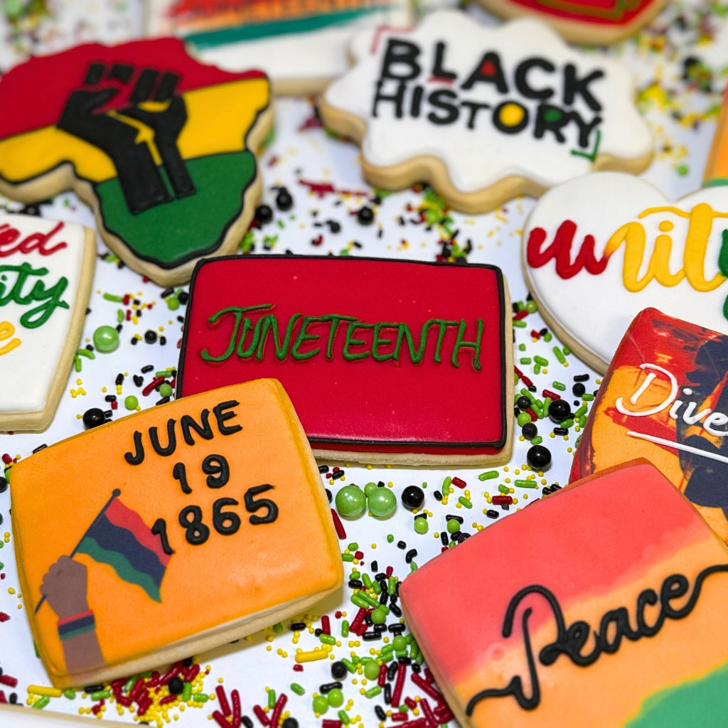 Assorted Juneteenth cookies with colorful icing and text.