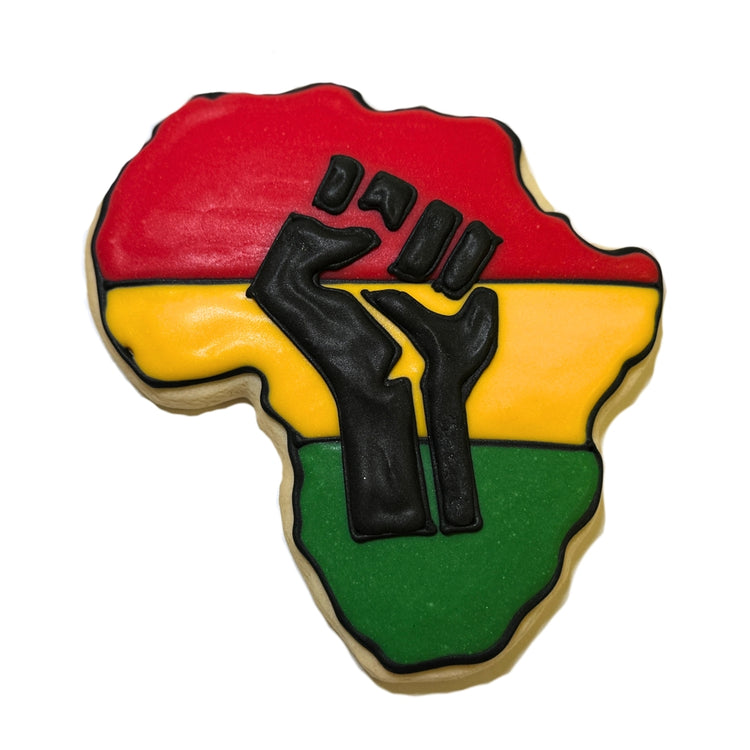 Juneteenth cookie shaped like Africa with a black fist design.