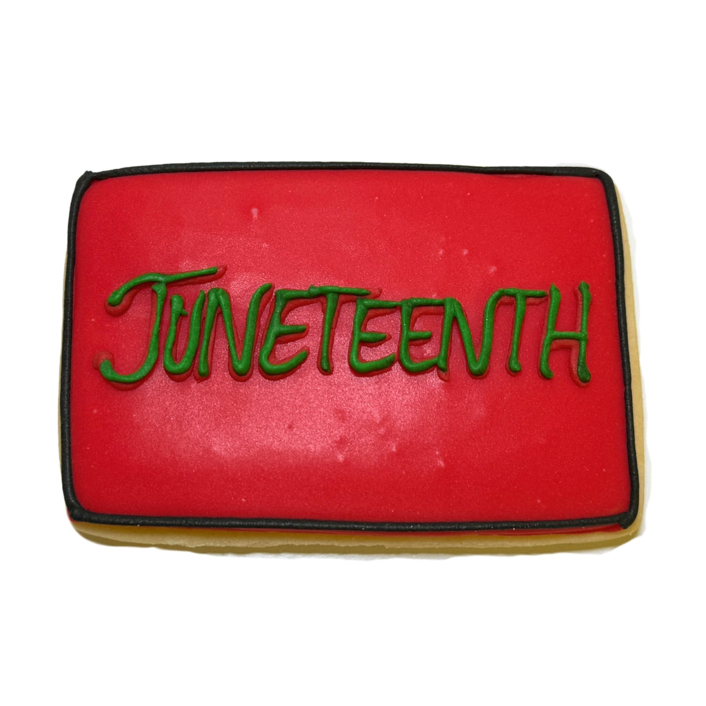 Rectangular Juneteenth cookie with red icing and green text.