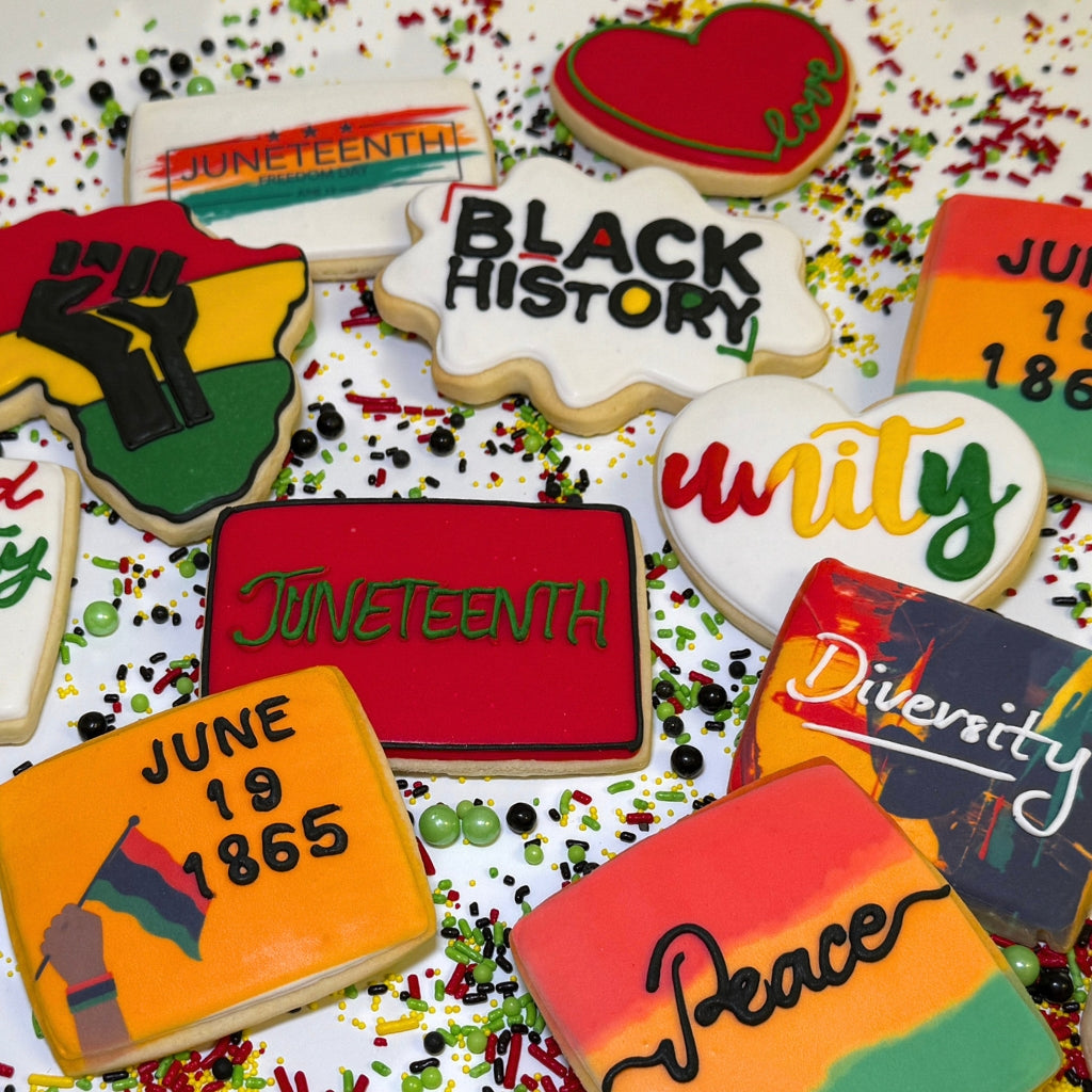 Assorted Juneteenth cookies with colorful icing and text.