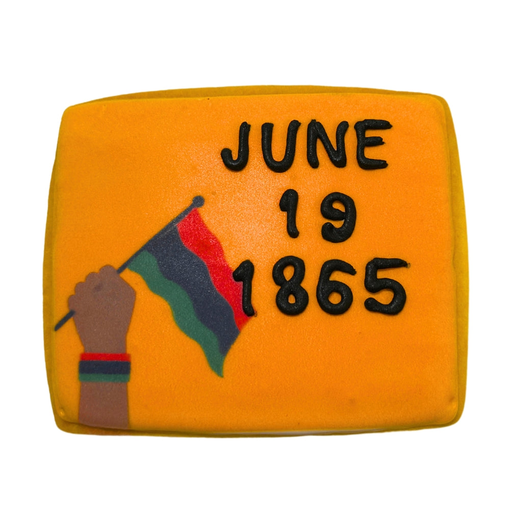 Juneteenth cookie with a fist, flag, and date in icing.