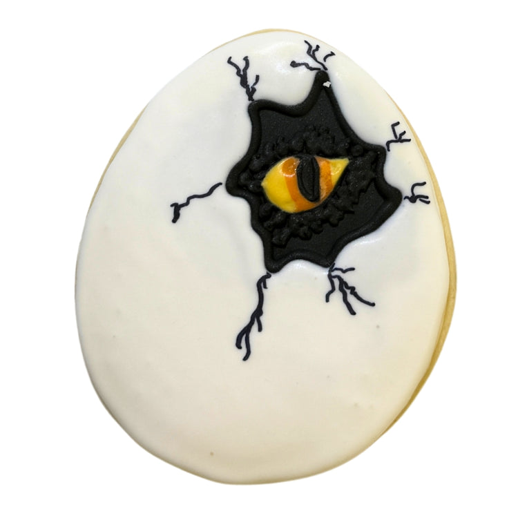 Jurassic Cookie shaped like a cracked egg with a reptile eye.