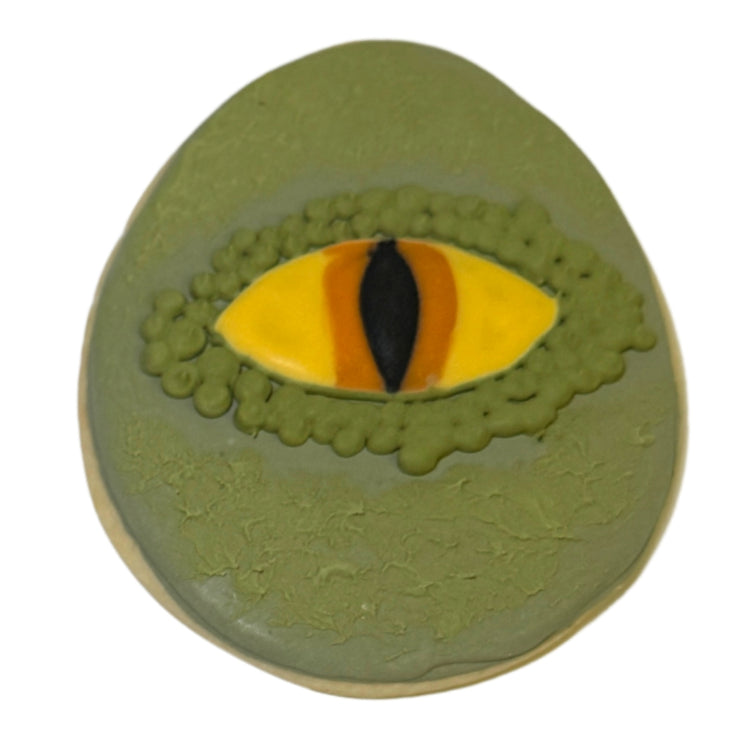 Jurassic Cookie with a green dinosaur eye design