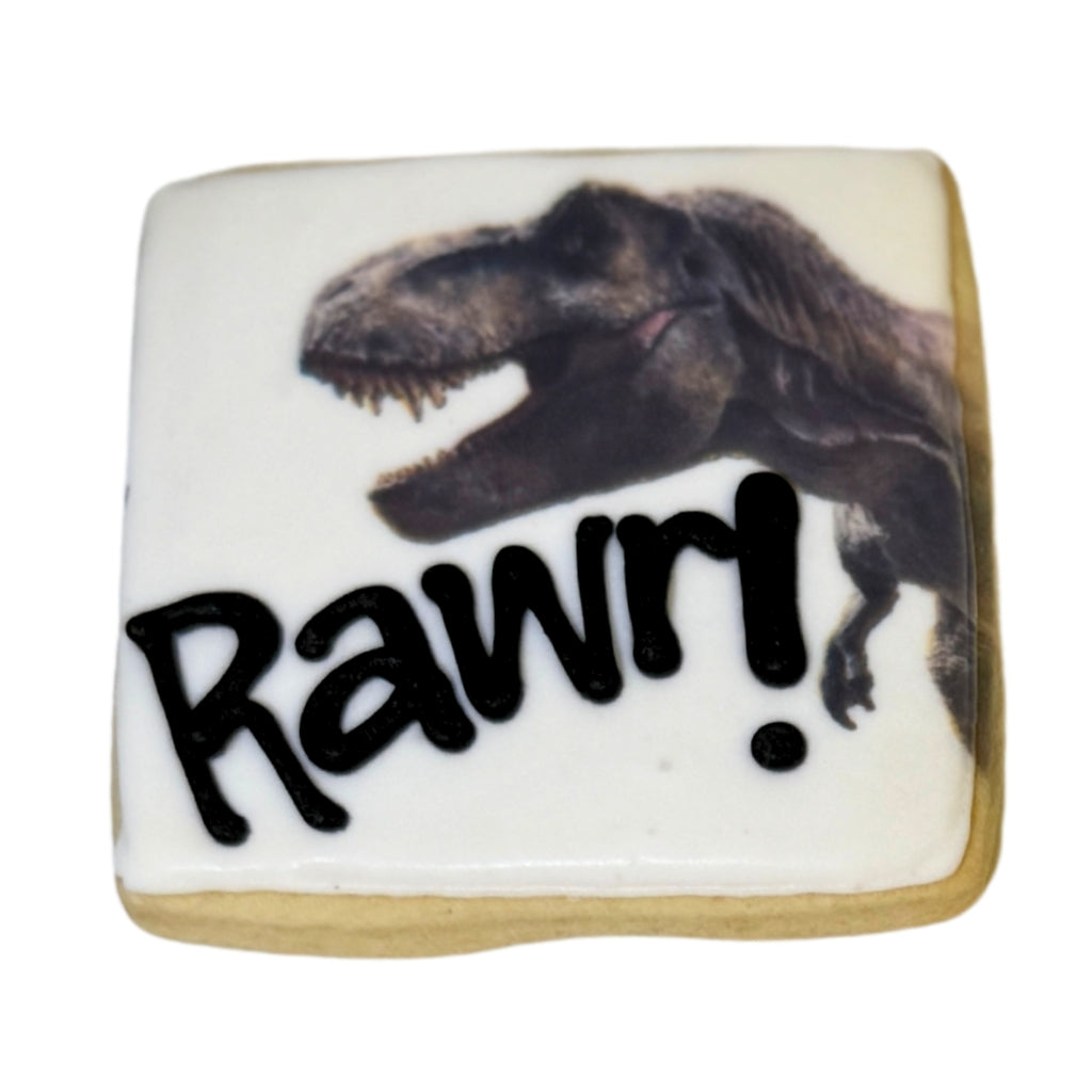 Jurassic Cookie with T-Rex image and black Rawr text.