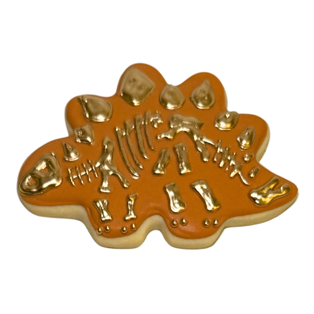 Jurassic Cookie with metallic gold dinosaur skeleton icing