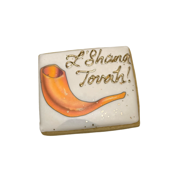 Square Jewish High Holidays cookie with shofar and gold text.