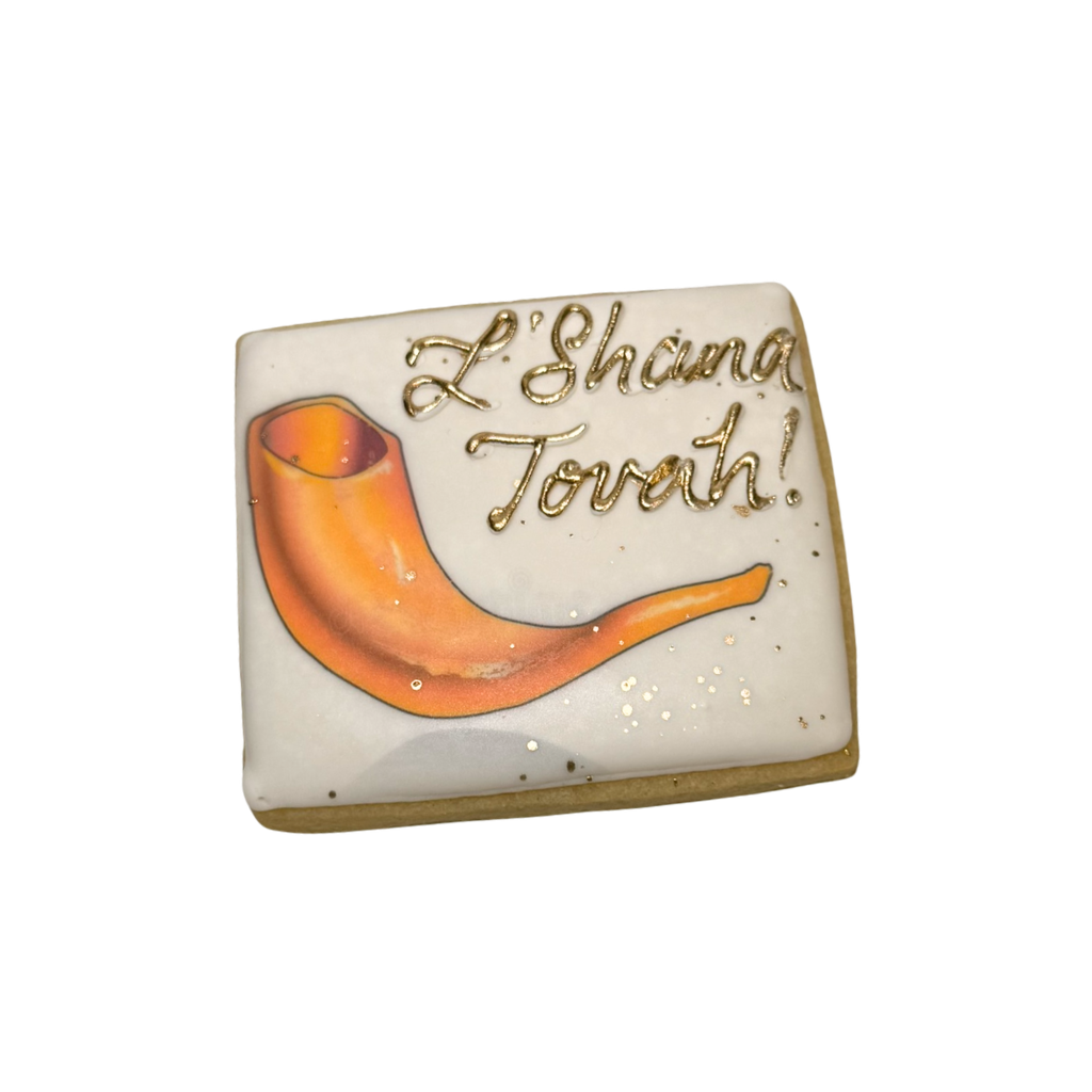 Square Jewish High Holidays cookie with shofar and gold text.
