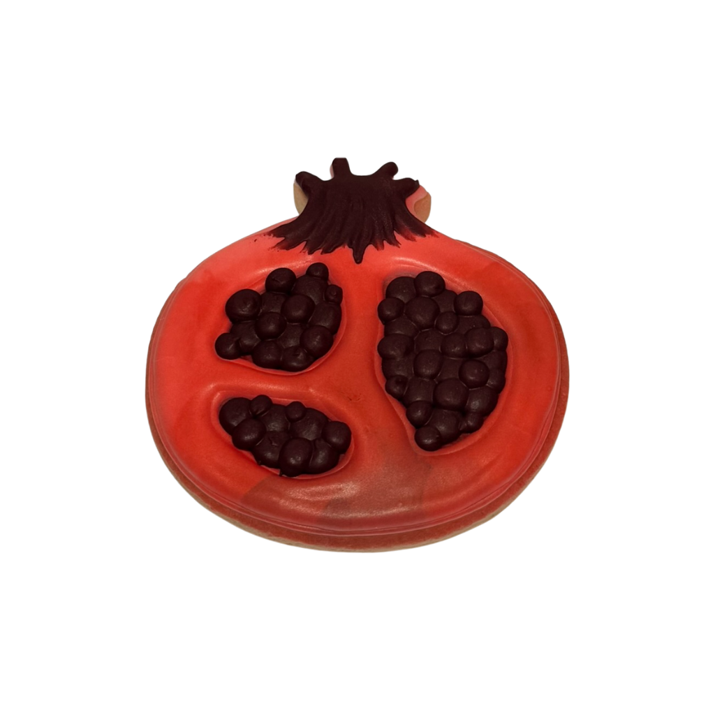 Jewish High Holidays pomegranate-shaped cookie with red icing