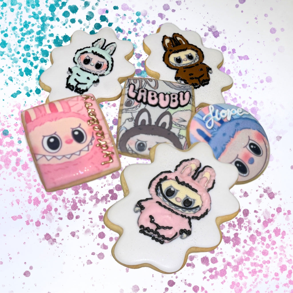 Assorted The Monsters cookies with colorful character icing.