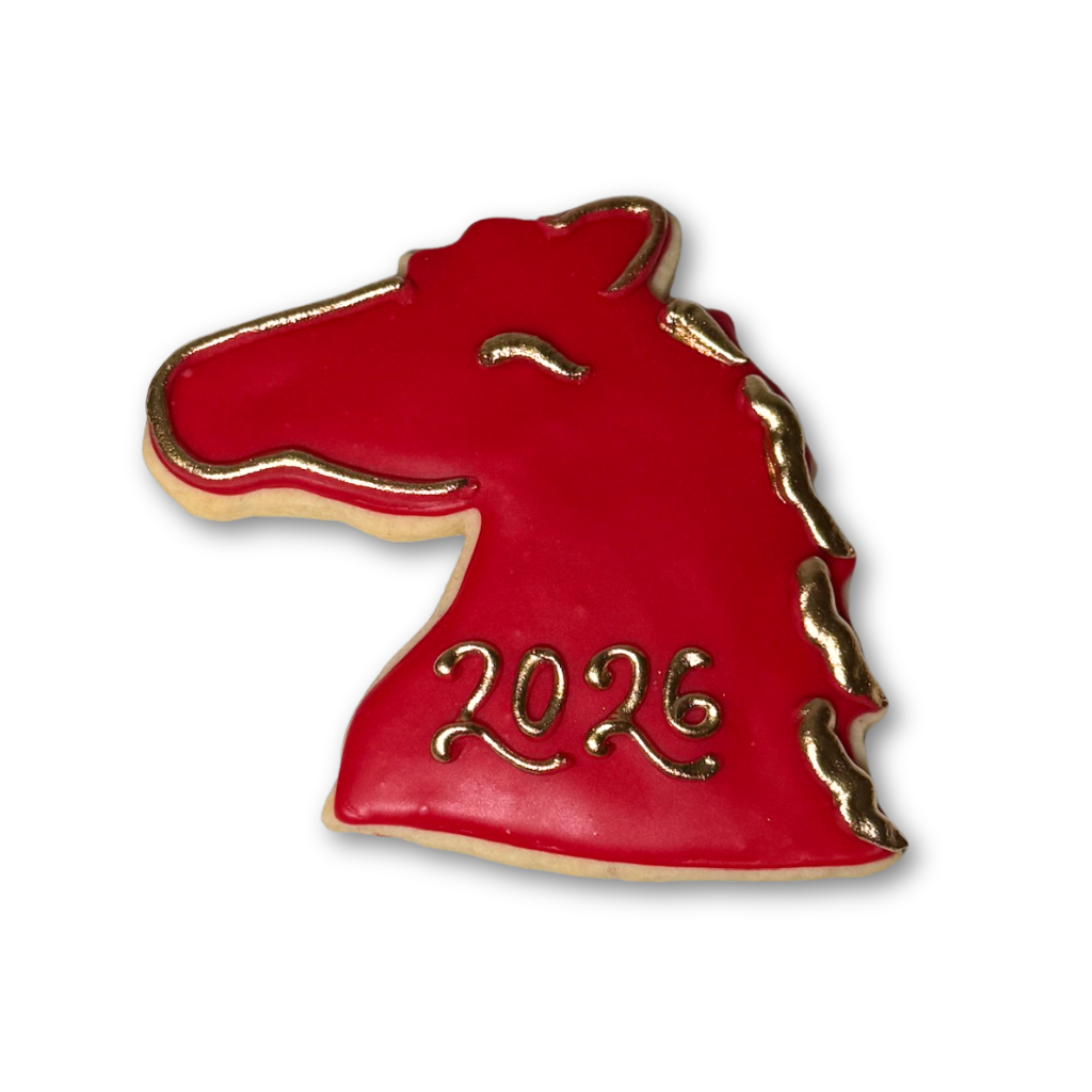 Red horse-shaped Lunar New Year cookie with gold 2026 detail.