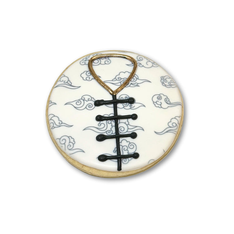 Lunar New Year cookie with cloud pattern and black knot design