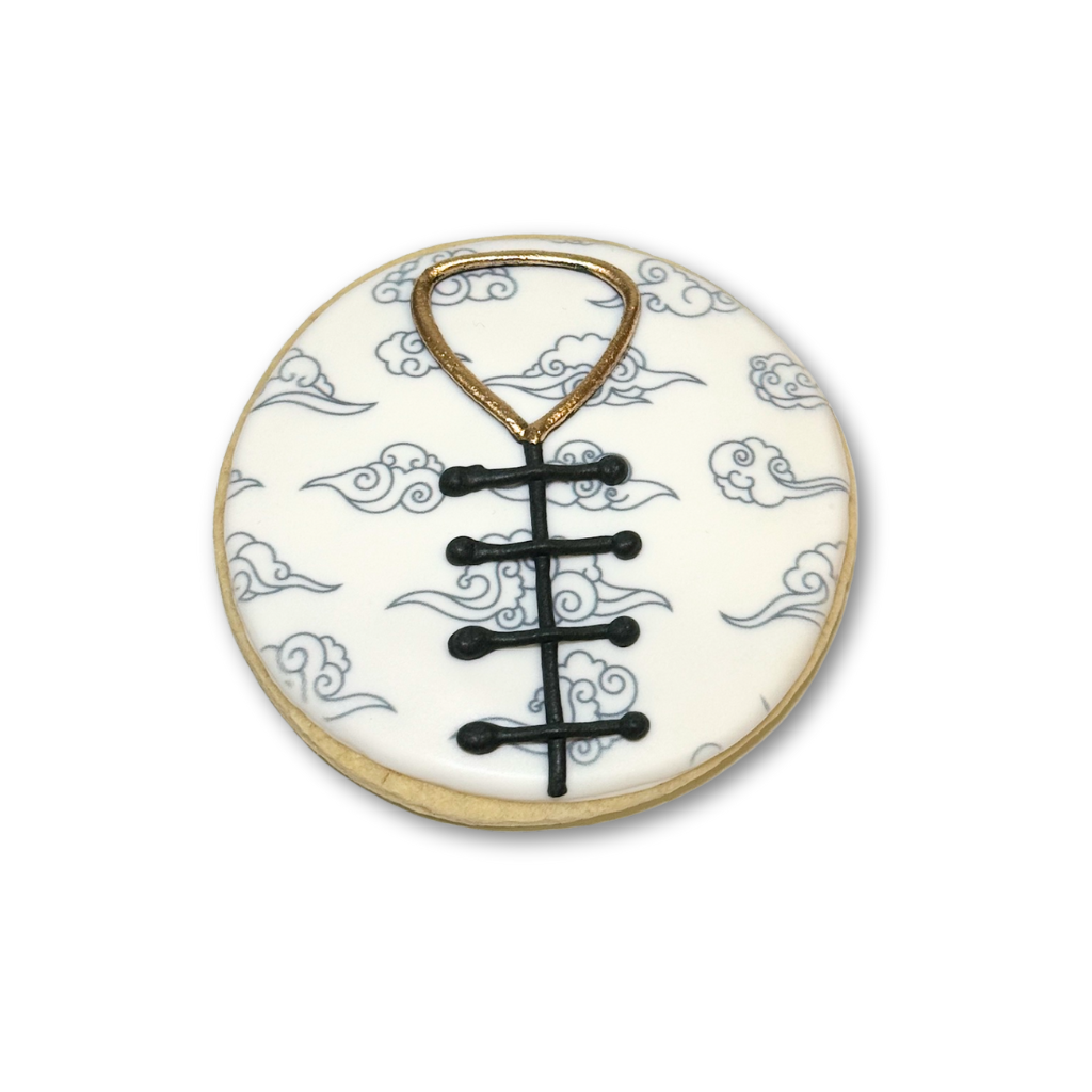 Lunar New Year cookie with cloud pattern and black knot design
