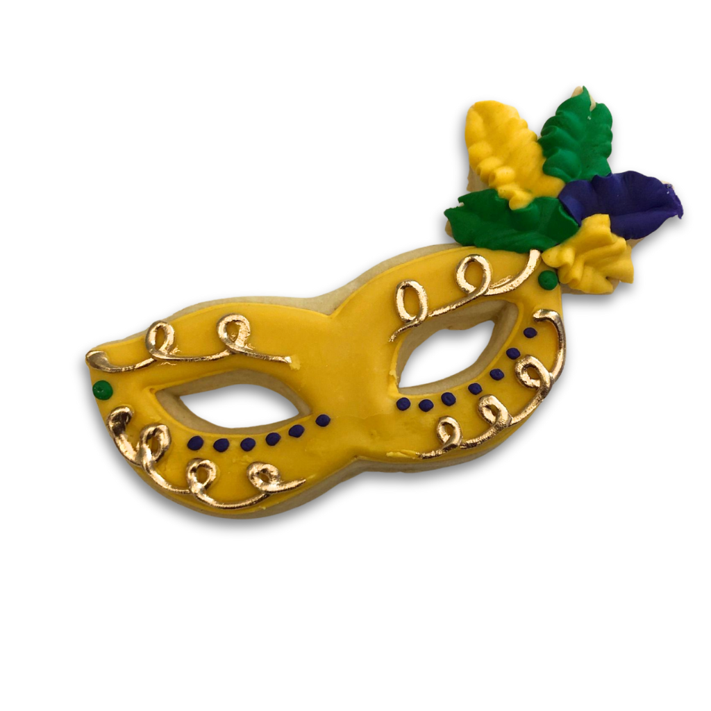 Mardi Gras butter cookie shaped like a yellow masquerade mask.