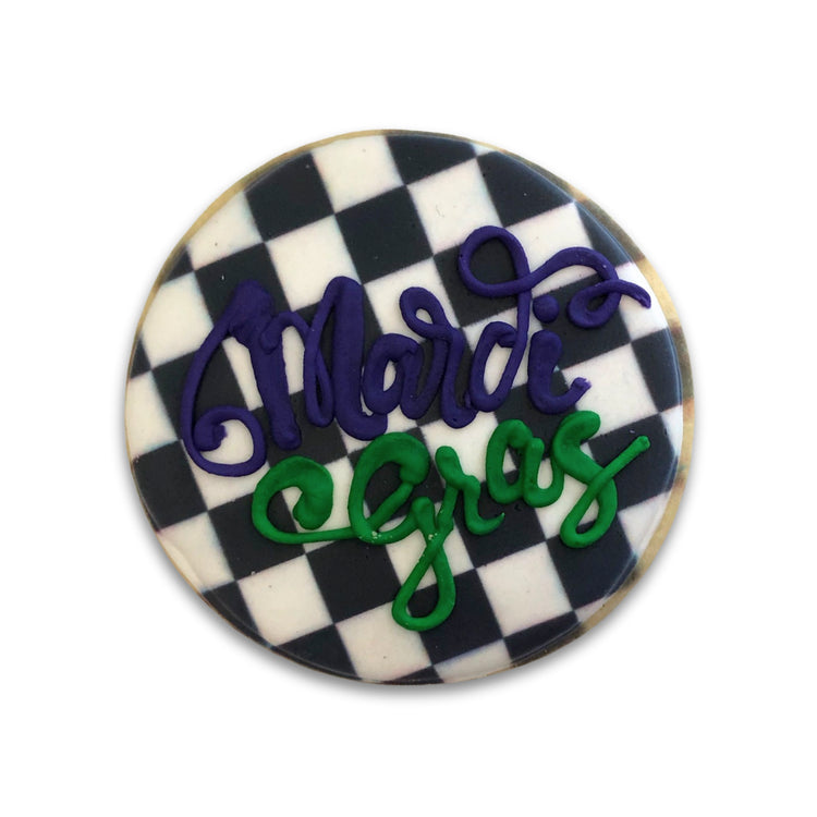 Mardi Gras butter cookie with a black and white checkered design.