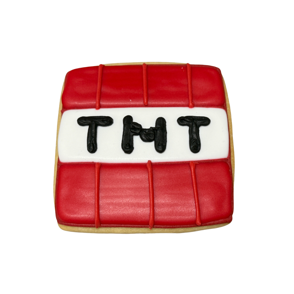 Minecraft TNT block cookie with red and white icing.
