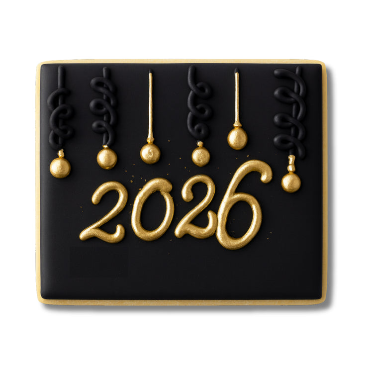 New Year 2026 cookie with black icing and gold ornaments
