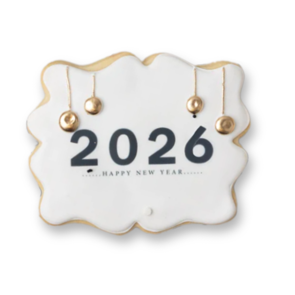 New Year 2026 cookie with white icing and gold ornaments.