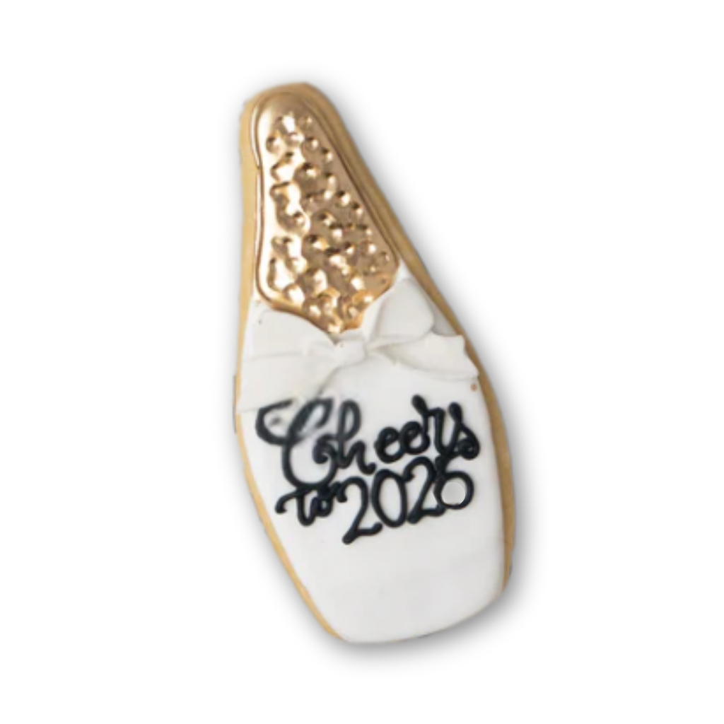 New Year cookie shaped like a champagne bottle with 2026 text.