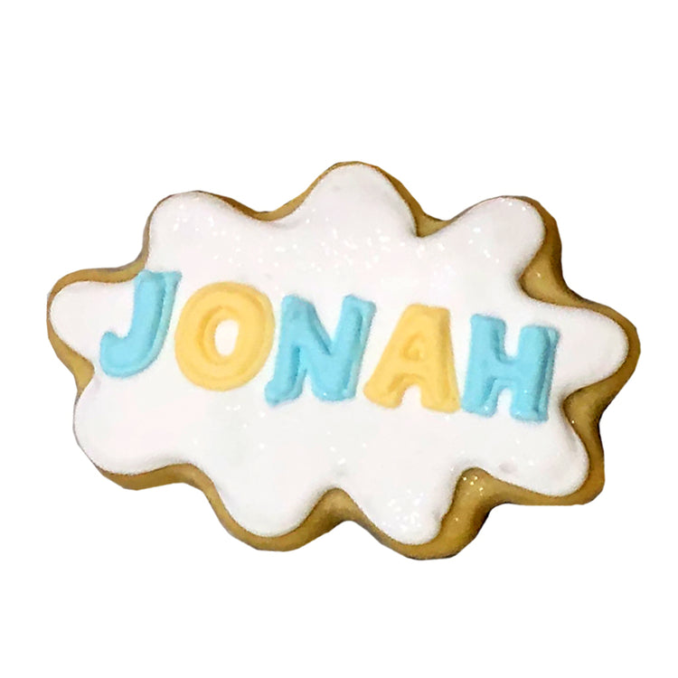 Winnie name plaque cookie with blue and yellow lettering.