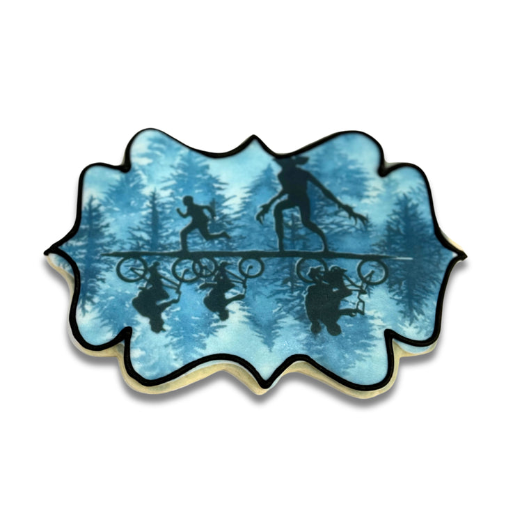 Stranger Cookies with blue forest and silhouette design