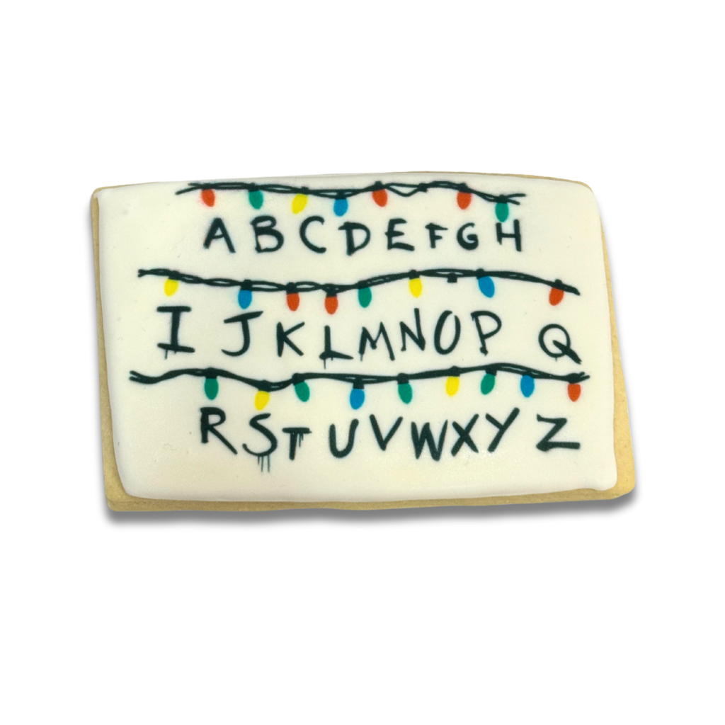Stranger Cookies with alphabet and colorful string lights.