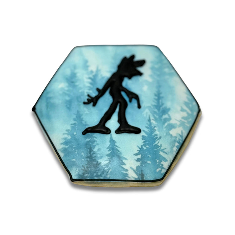 Stranger Cookies featuring a black creature in a blue forest.