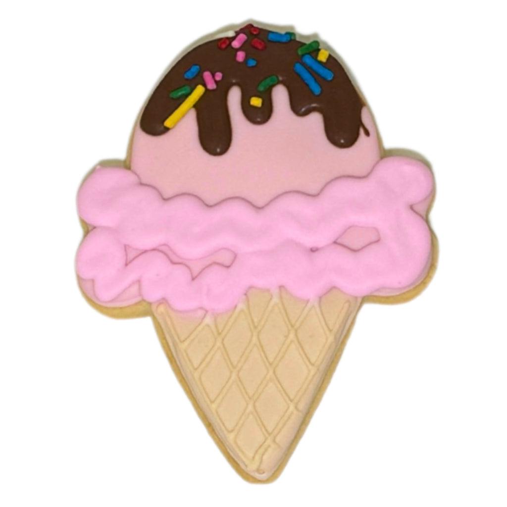 Summer cookie shaped like an ice cream cone with sprinkles.