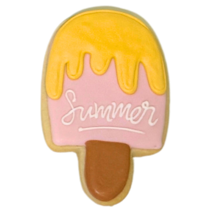 Summer cookie shaped like a pink and yellow popsicle.