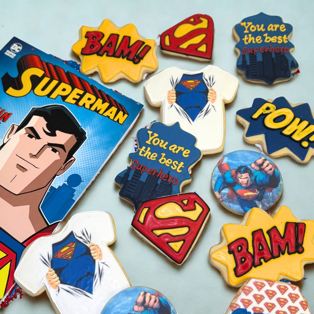 Assorted Superman themed sugar cookies with comic book designs