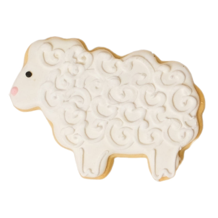 National Reading Month sheep-shaped cookie with white icing.