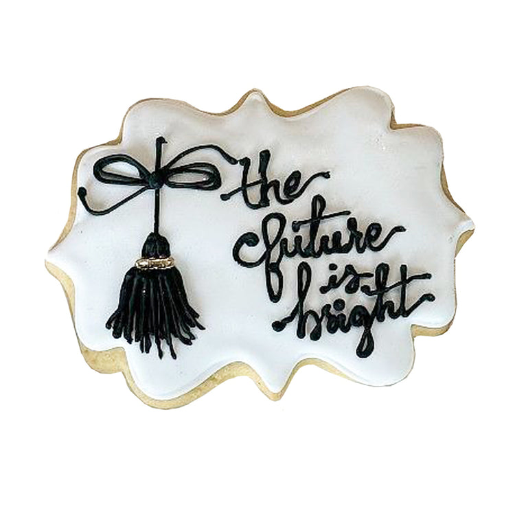 Bright Future cookie with white icing and black tassel design.