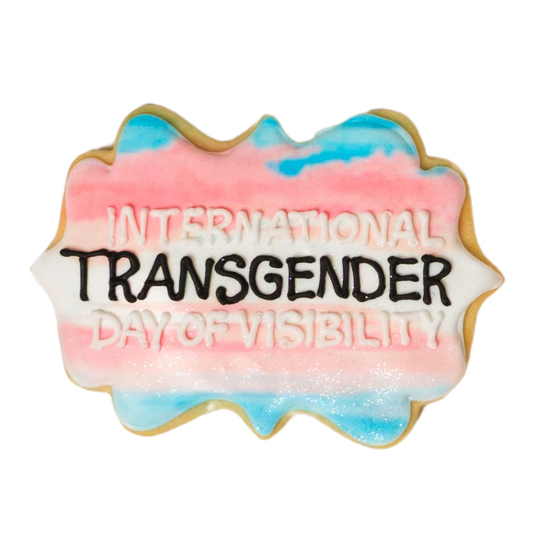 Trans Day of Visibility cookie with pink, white, and blue icing.