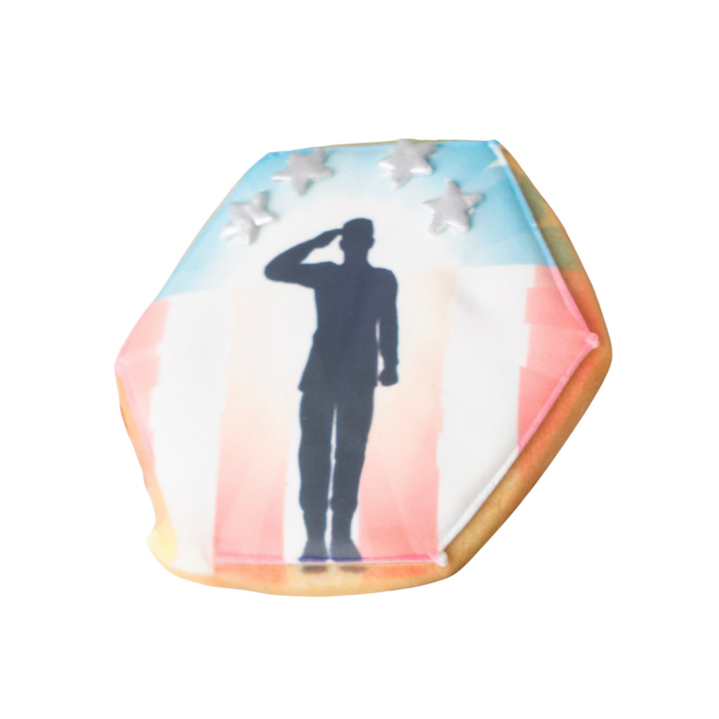 Veterans Day cookie with a soldier silhouette and stars.