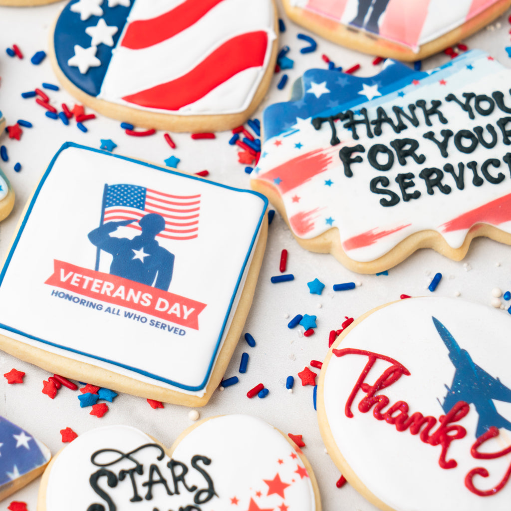 Assorted Veterans Day cookies with patriotic icing and sprinkles.