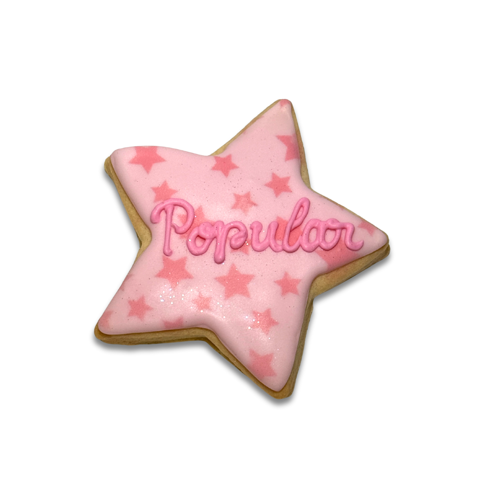 Wickedly Sweet star-shaped cookie with pink star icing