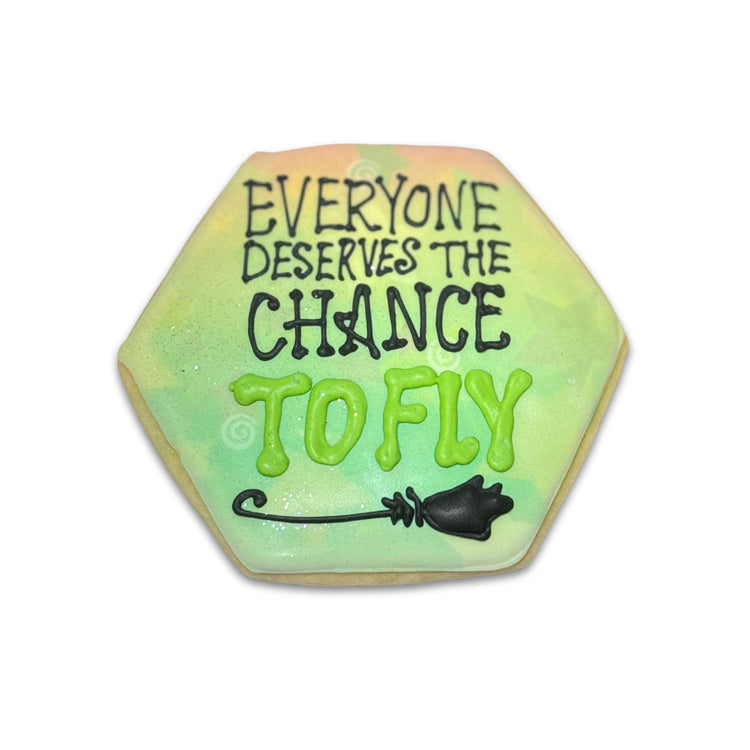 Wickedly Sweet hexagon cookie with green icing and text.