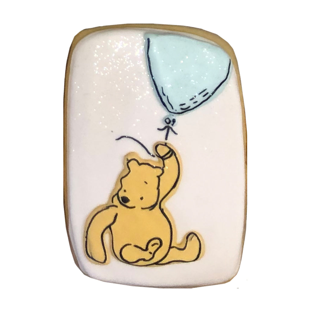 Winnie the Pooh rectangular cookie with a blue balloon.