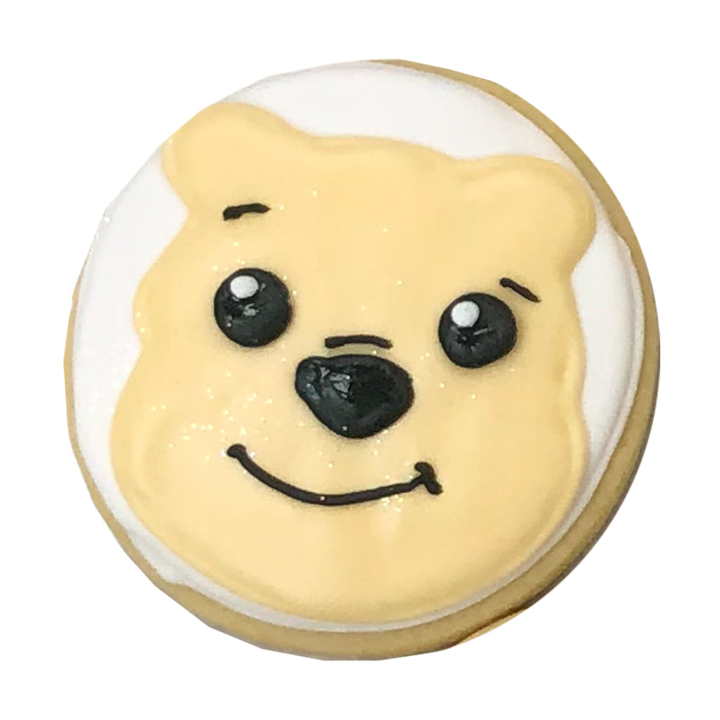 Winnie Face round sugar cookie with yellow icing.