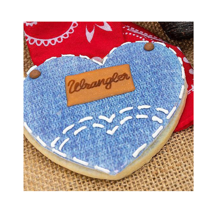 Wrangler blue jean heart cookie with white icing stitching.