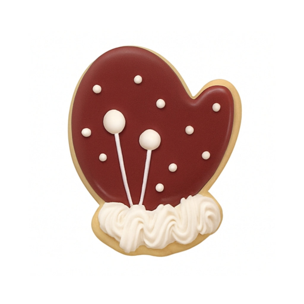 Christmas Couture mitten cookie with red icing and white trim.