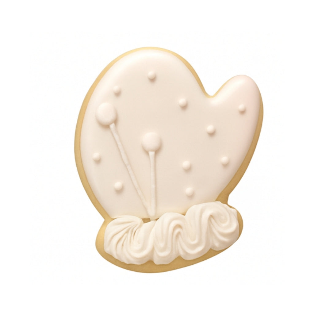 Christmas Couture mitten-shaped cookie with white icing