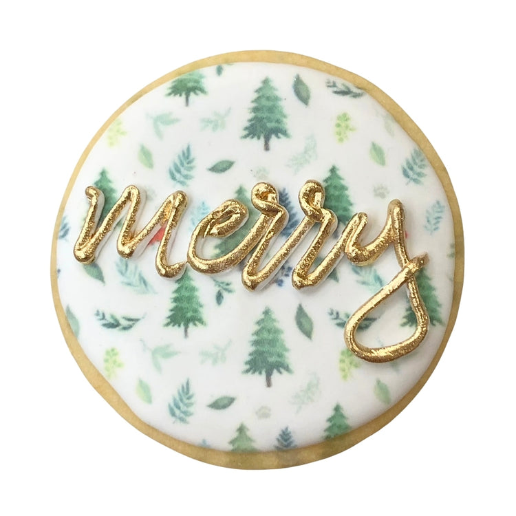 Holiday Greetings cookie with gold merry text and pine trees.