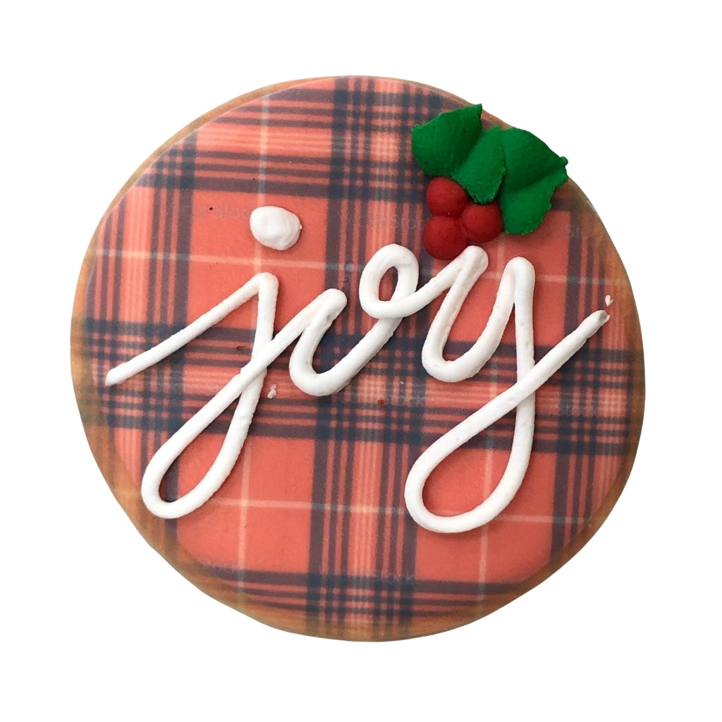 Holiday Greetings cookie with red plaid and white joy icing